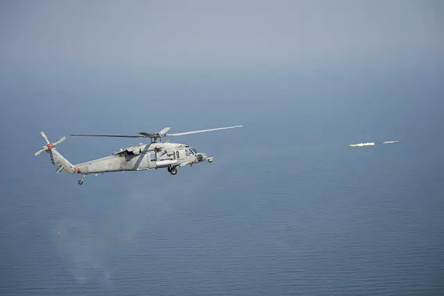 An MH-60S Seahawk helicopter fires the Advanced Precision Kill Weapons System (APKWS) from a modernized, digital rocket launcher (DRL) during a test event in fall 2013. The Direct Time and Sensitive Strike Weapons program (PMA-242) delivered DRL to Helicopter Sea Combat Squadron (HSC) 15 in March for pre-deployment training in preparation for deployment this summer. (U.S. Navy photo)