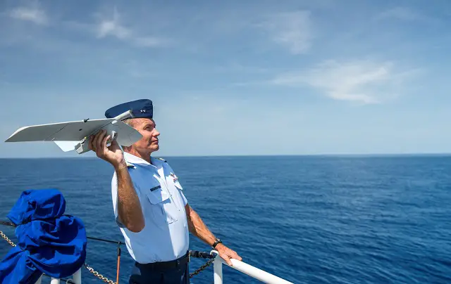 Rear Adm. John Korn, commander of the 7th Coast Guard District, launches an unmanned aircraft system during a testing phase onboard the Coast Guard Cutter Richard Etheridge. U.S. Coast Guard photo by Petty Officer 2nd Class Luke Clayton.