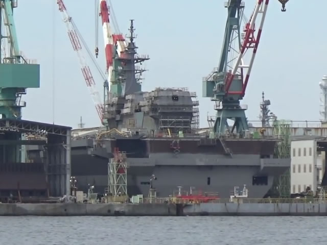 A video taken by a Japanese spotter shows the construction on Japan Maritime Self Defense Force (JMSDF) second Izumo-class Helicopter Destroyer DDH-184 is almost complete with the mast now in place. In addition, the JMSDF announced that the vessel will be named and launched in the water at the JMU Japan Marine United Corporation shipyard in Yokohama Isogo during an official ceremony on August 27.
