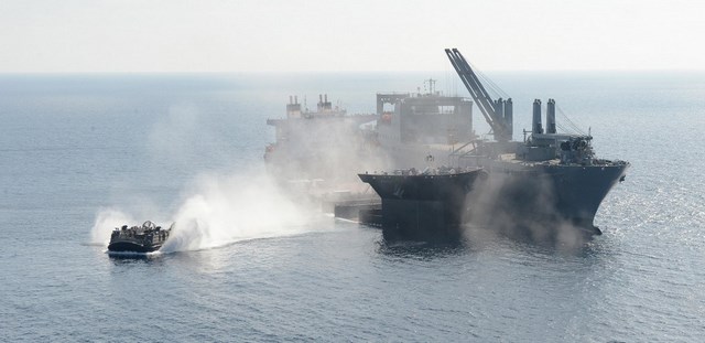 LCACs are used to transfer equipment and vehicles to and from the ship to the shore.An LCAC transports an LVSR ashore during offload operations.
