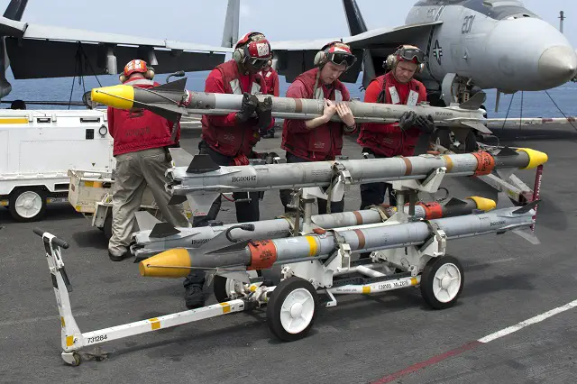 Sailors assigned to the Jolly Rogers of Strike Fighter Squadron (VFA) 103 transport a AIM-9X Sidewinder air intercept missile (AIM) on the flight deck of the aircraft carrier USS Dwight D. Eisenhower (CVN 69). Dwight D. Eisenhower is deployed to the U.S. 5th Fleet area of responsibility conducting maritime security operations, theater security cooperation efforts and support missions as part of Operation Enduring Freedom. (U.S. Navy photo by Mass Communication Specialist Seaman Andrew Schneider/Released)
