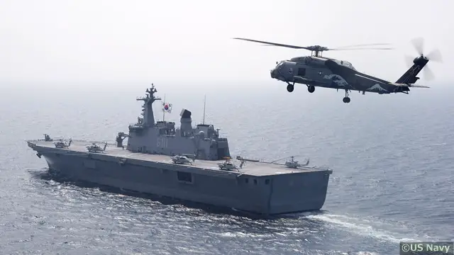 A U.S. Marine Corps MV-22B Osprey tiltrotor aircraft made its first ever landing on the flight deck of a Republic of Korea Navy amphibious assault ship off the coast of the Korean peninsula, March 26, 2015. The Osprey departed from the USS Bonhomme Richard (LHD 6) nearby and landed on the ROK ship Dokdo (LPH-6111).