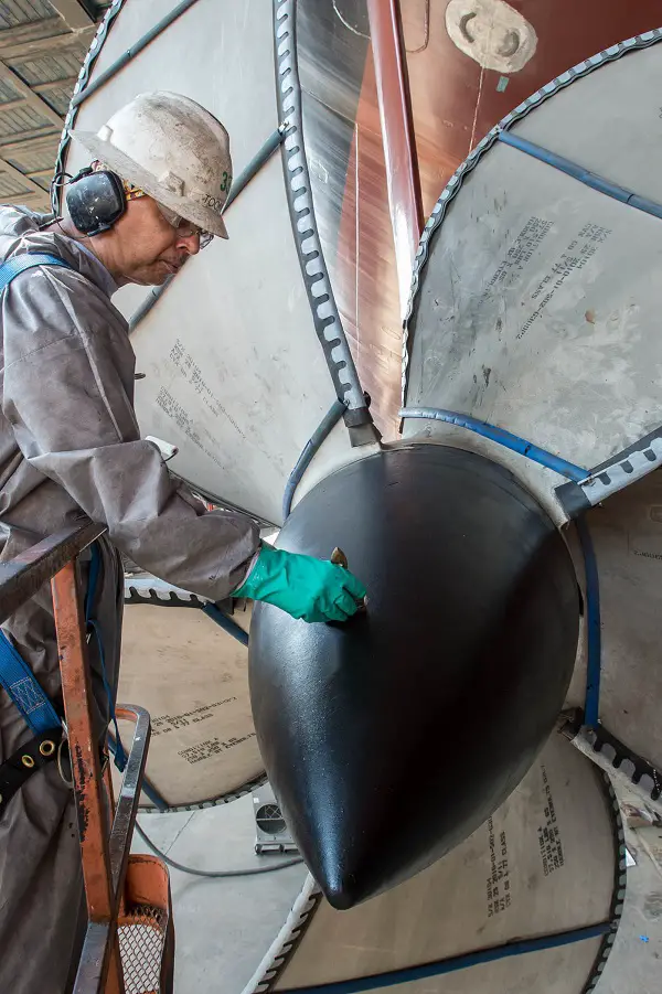 Huntington Ingalls Industries (HII) announced today that the nuclear-powered aircraft carrier Gerald R. Ford (CVN 78) has put on significant weight in the dry dock at its Newport News Shipbuilding division with the installation of four 30-ton bronze propellers. At 21 feet in diameter, each propeller spins to push the aircraft carrier through the water.