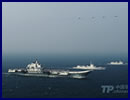 The Chinese navy released on Wednesday the first photographs of what many military observers believe is the Liaoning aircraft carrier battle group as the nation's first aircraft carrier returned to its homeport of Qingdao, Shandong province. The photos show the Liaoning sailing with several battleships, submarines and military aircraft performing a series of drills. The navy did not disclose when and where they were taken.