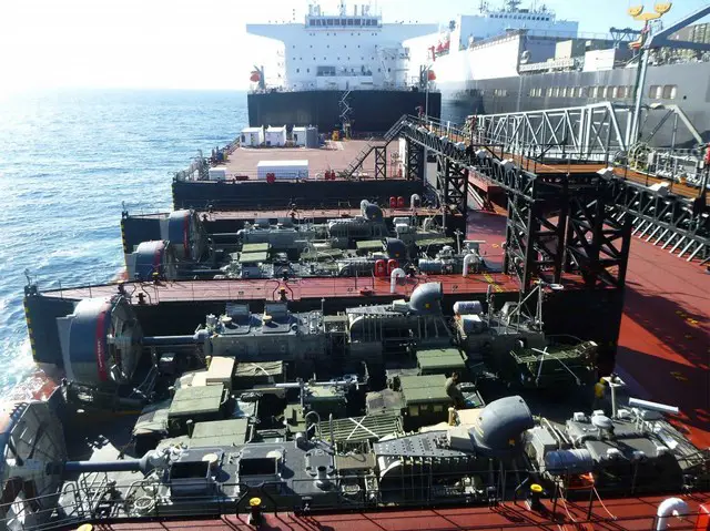 USMC Vehicles transit from Dahl on to Montford Point and are loaded on two LCACs which will deliver the equipment ashore during the Pacific Horizon 2015 exercise.