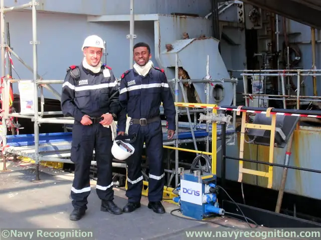 The crew of the aircraft carrier takes part in the mid-life refit operations of their vessl too.