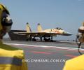 The picture taken on June 19 shows that a ship-borne J-15 fighter is ready to take off. (Chinamil.com.cn/Li Tang)